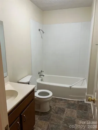 a bathroom with a sink a toilet and a bathtub