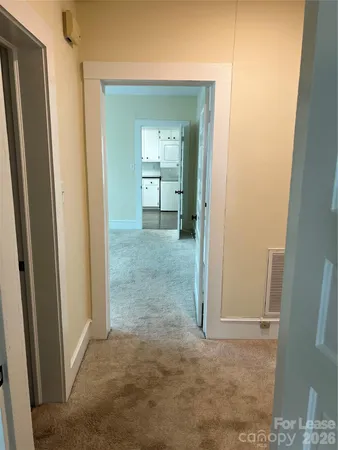 a view of a big room with closet and mirror