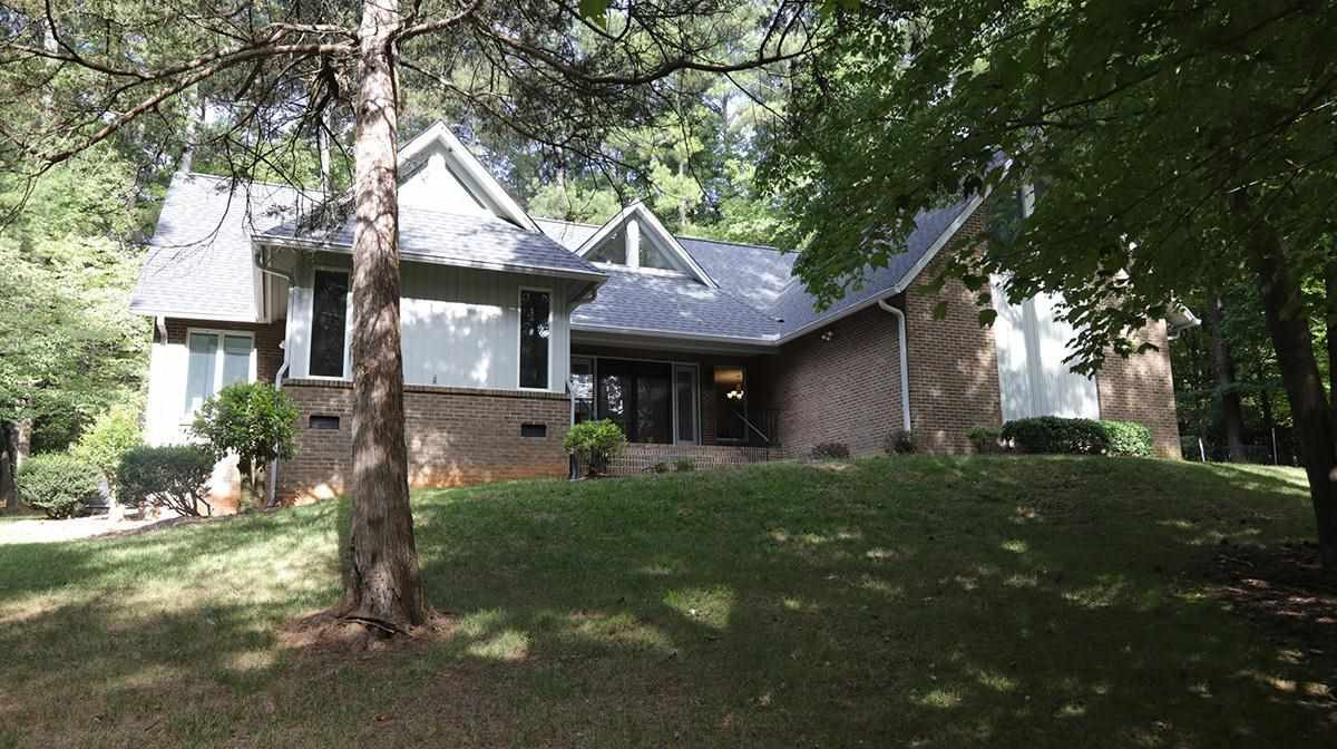 8837 Woodyhill Road Raleigh, NC 27613 - Photo 2 of 26 Facade/Exterior Front