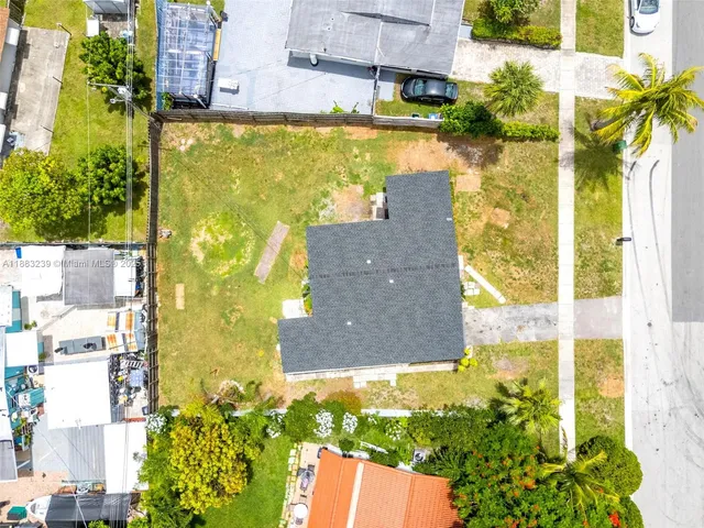 a view of a swimming pool with a yard