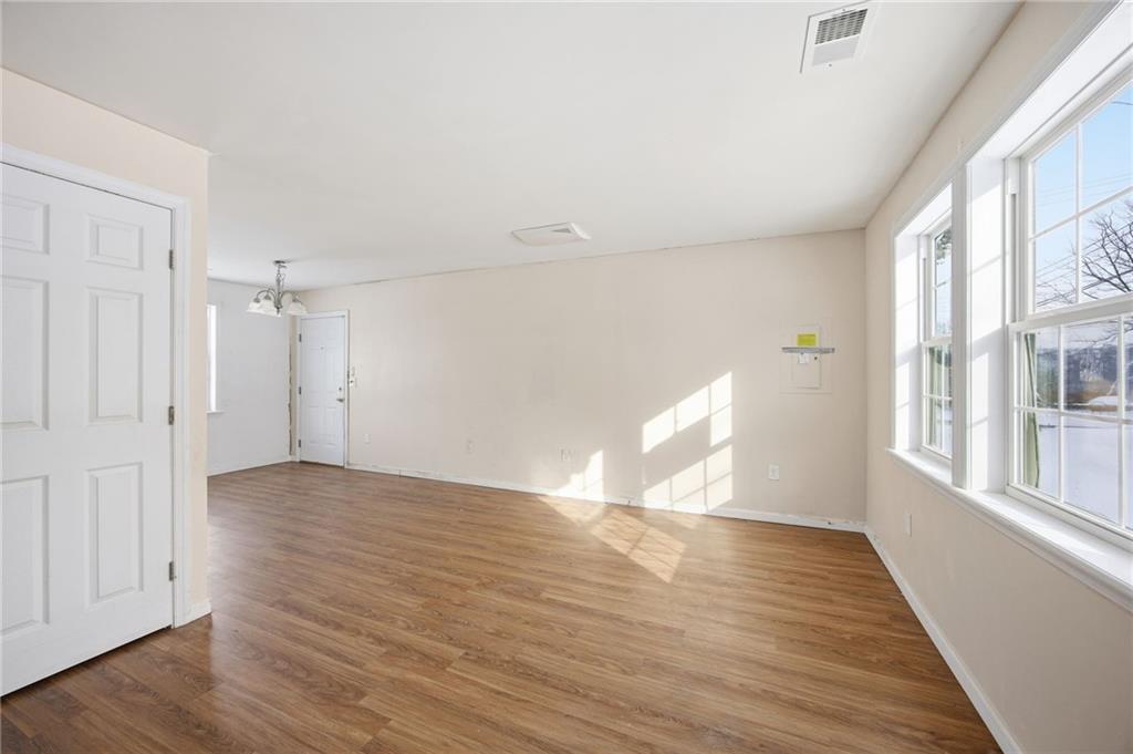 508 Fern Alley Duquesne, PA 15110 - Photo 4 of 18 a view of an empty room with wooden floor and a window