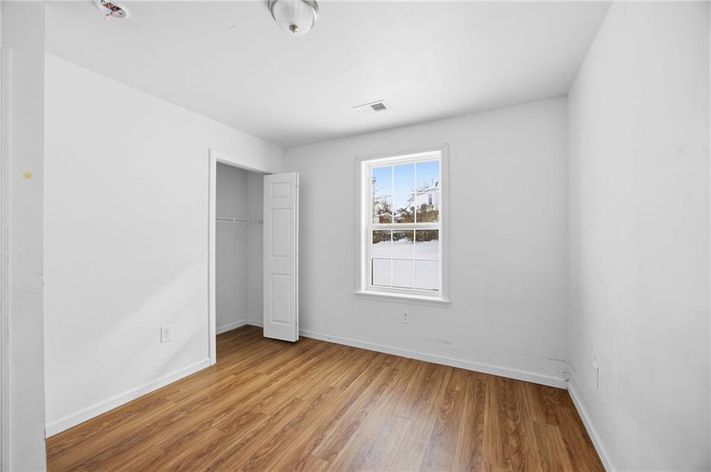 508 Fern Alley Duquesne, PA 15110 - Photo 10 of 18 a view of an empty room with wooden floor and a window