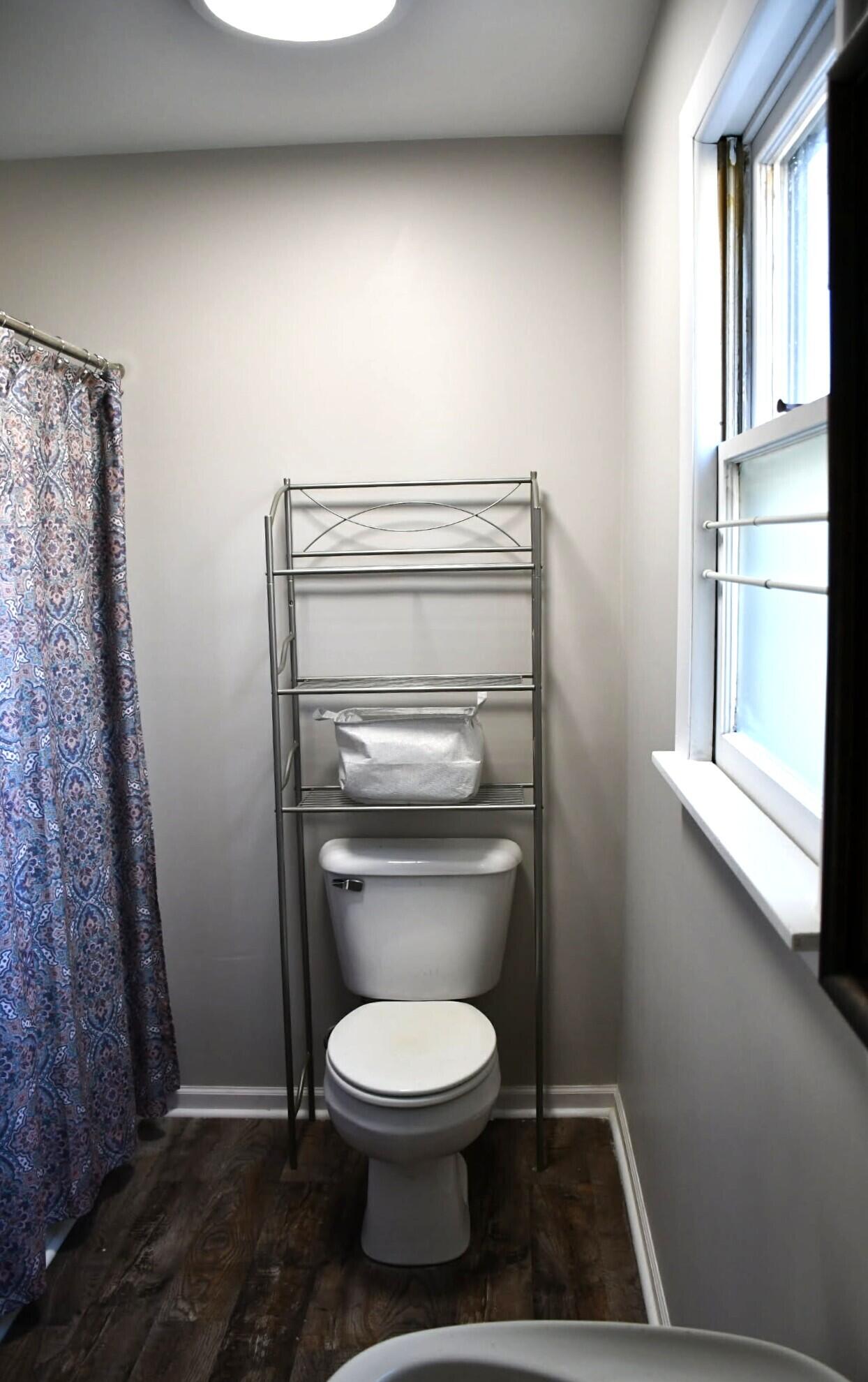 1645 Tulip Lane Munster, IN 46321 - Photo 12 of 23 a bathroom with a toilet and a vanity