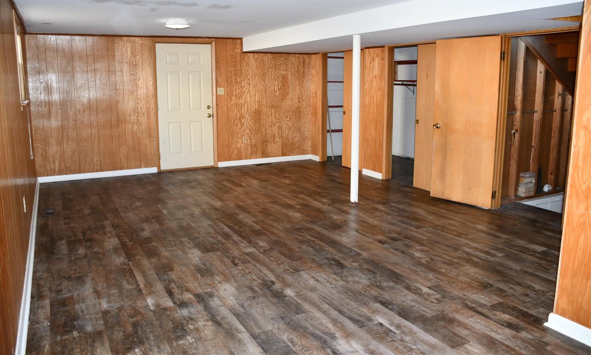 1645 Tulip Lane Munster, IN 46321 - Photo 13 of 23 a view of an empty room with wooden floor and a window