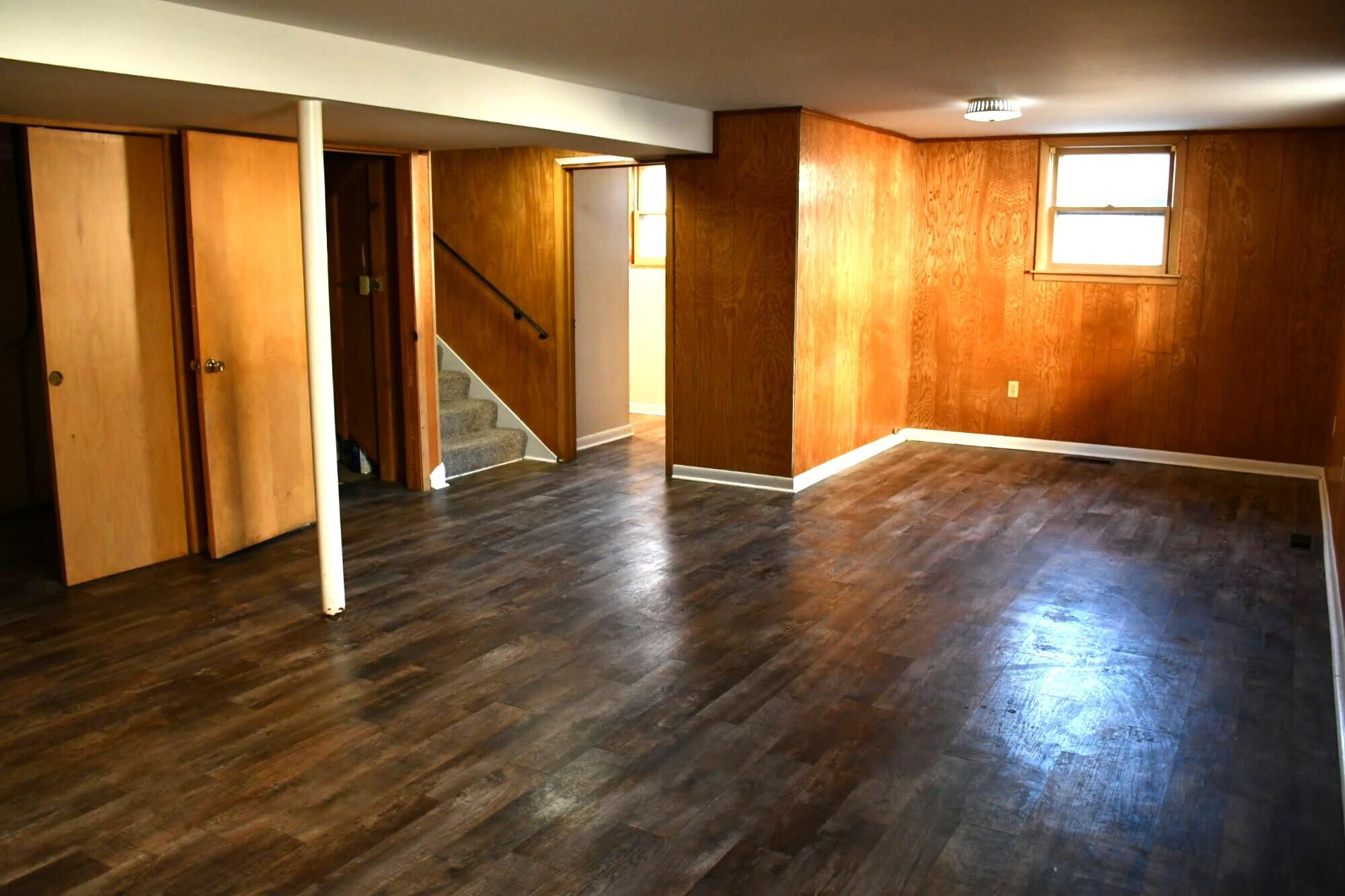 1645 Tulip Lane Munster, IN 46321 - Photo 14 of 23 an empty room with wooden floor and windows