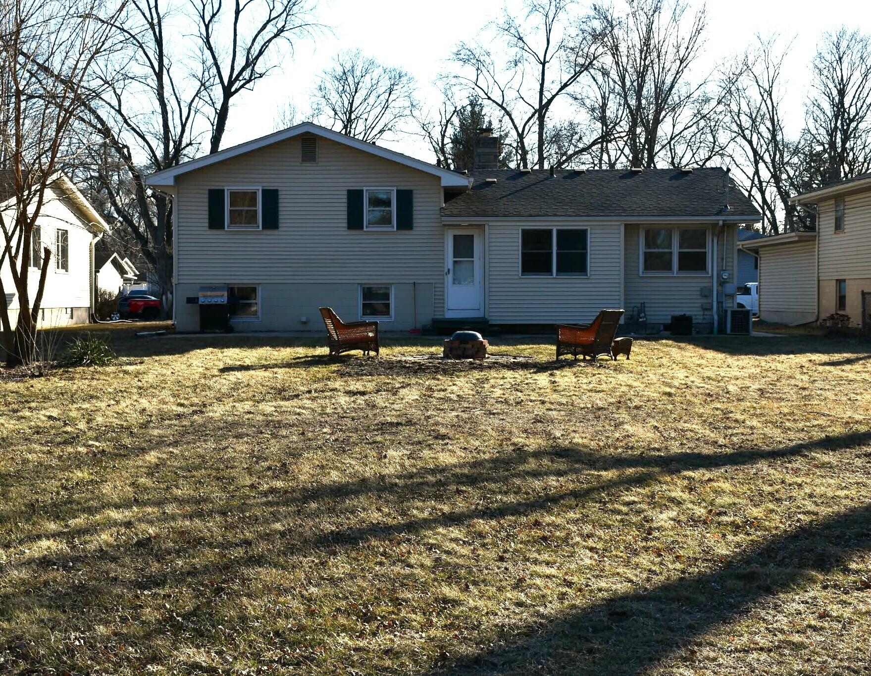 1645 Tulip Lane Munster, IN 46321 - Photo 20 of 23 a backyard of a house with yard and trees