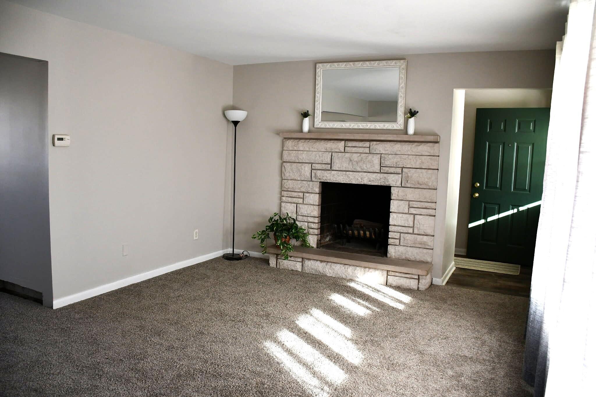 1645 Tulip Lane Munster, IN 46321 - Photo 4 of 23 a living room with a fireplace