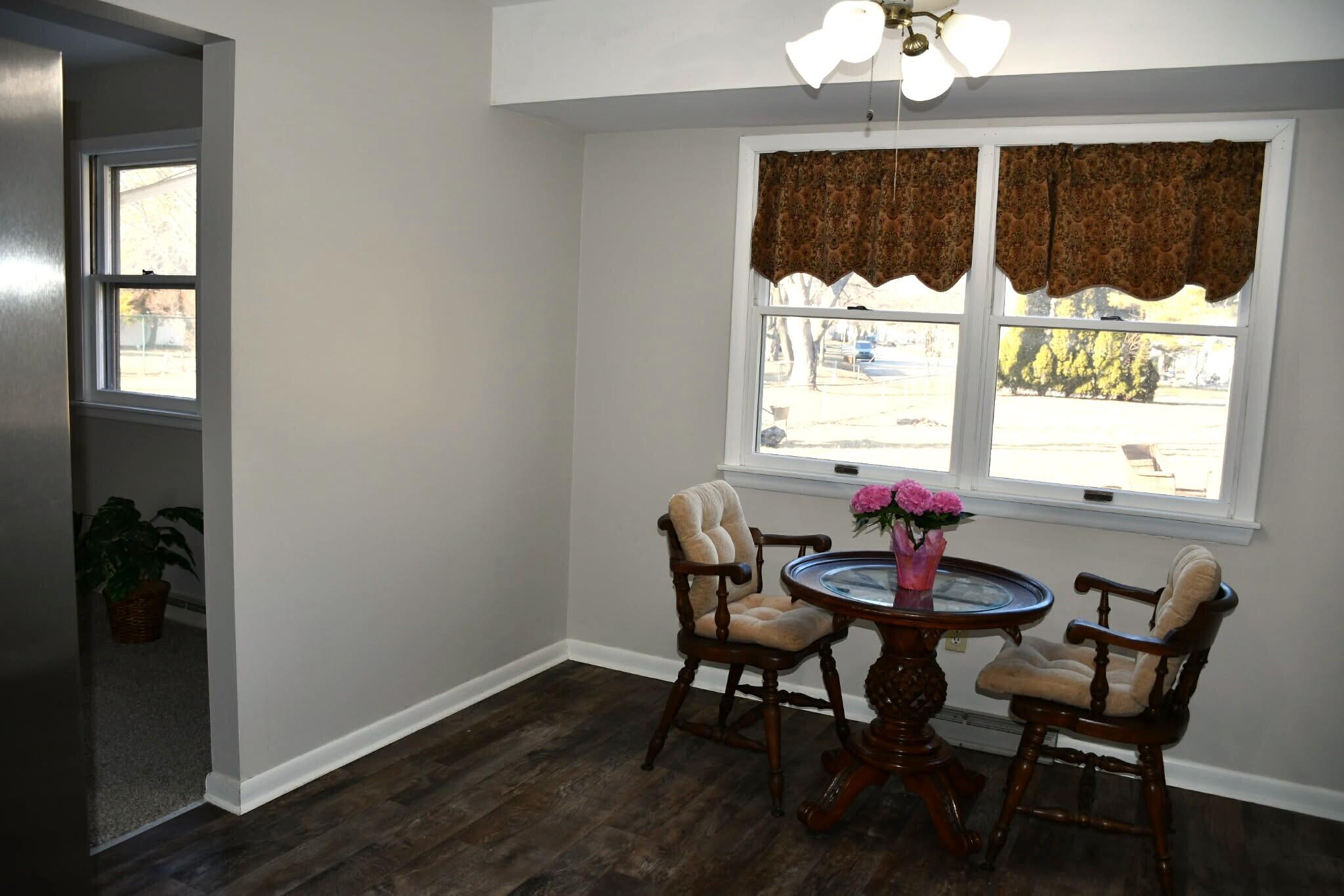 1645 Tulip Lane Munster, IN 46321 - Photo 8 of 23 a view of a dining room with furniture window and outside view
