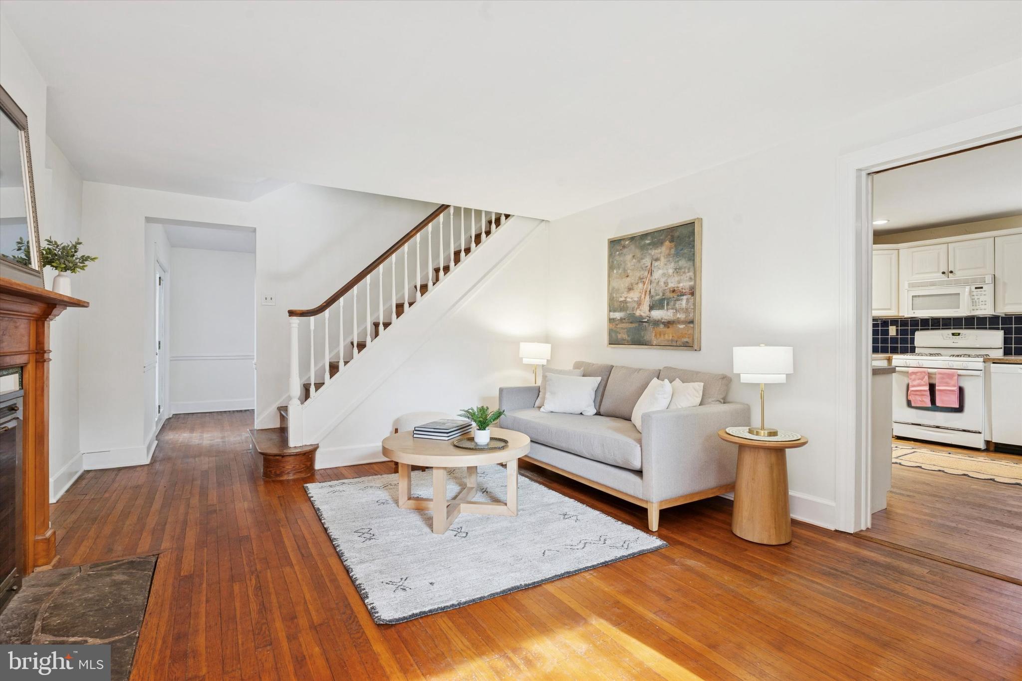 25 Green Valley Road Wallingford, PA 19086 - Photo 15 of 63 a living room with furniture and a wooden floor