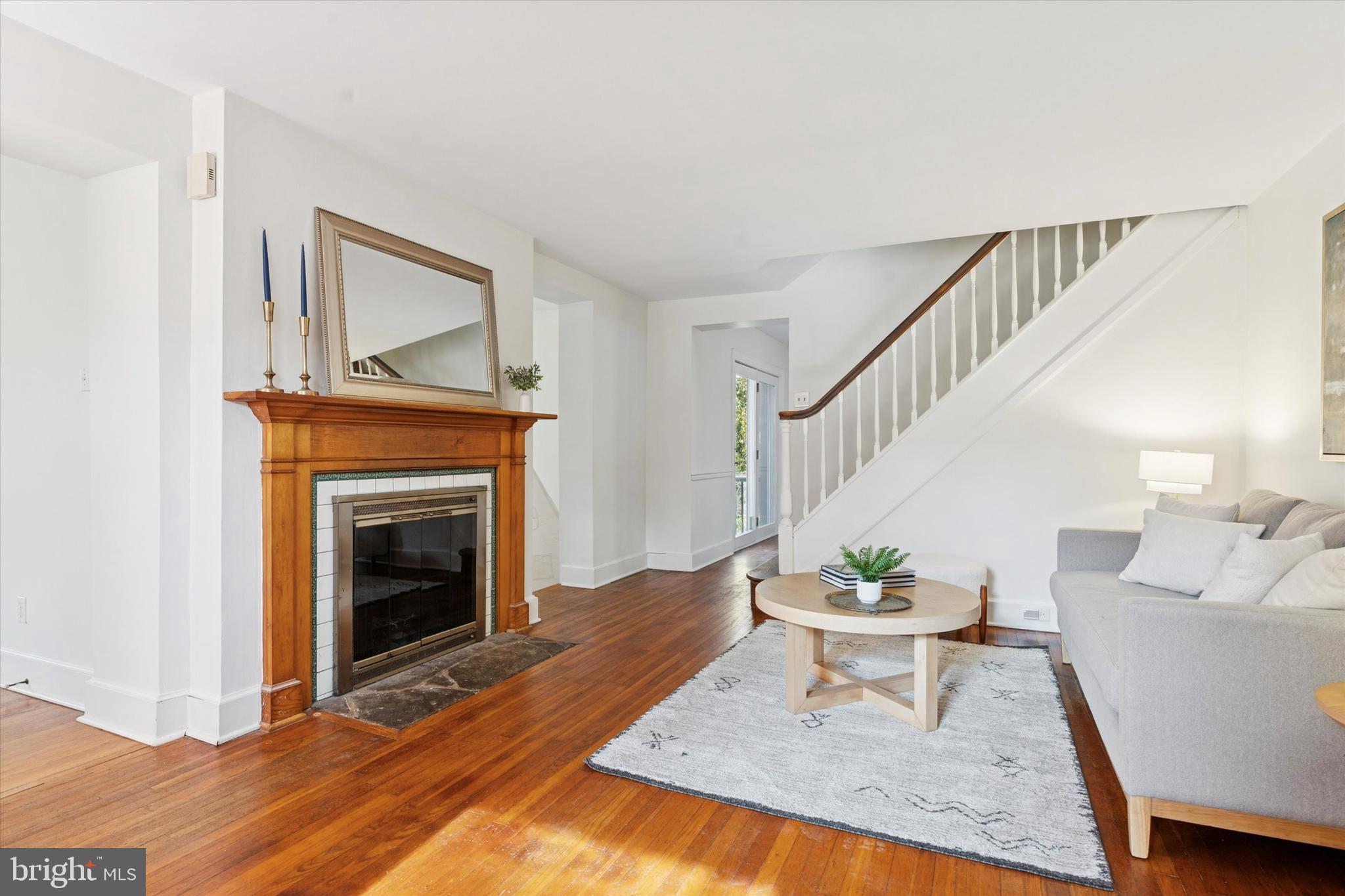 25 Green Valley Road Wallingford, PA 19086 - Photo 16 of 63 a living room with furniture and a fireplace