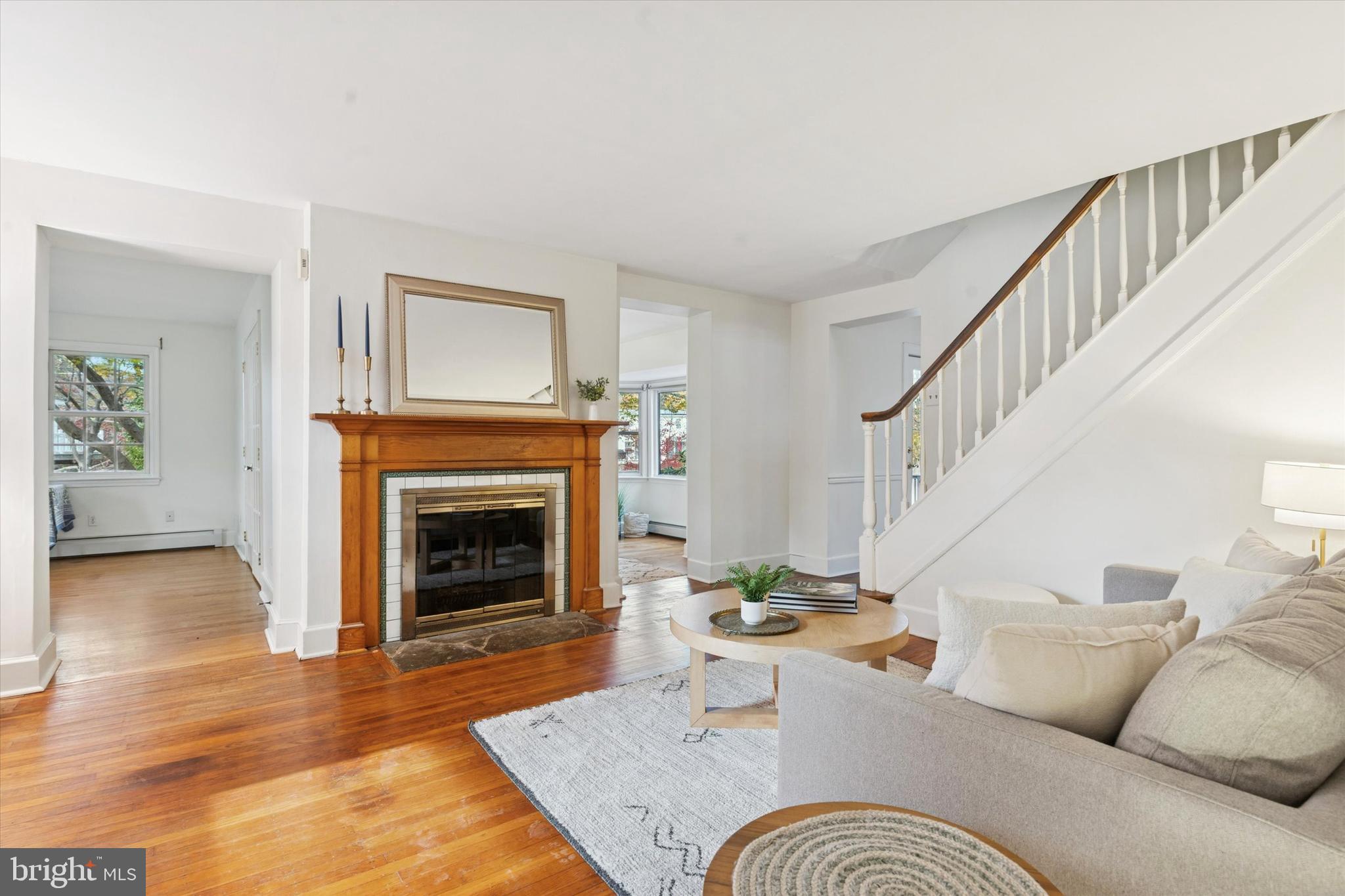 25 Green Valley Road Wallingford, PA 19086 - Photo 17 of 63 a living room with furniture and a fireplace