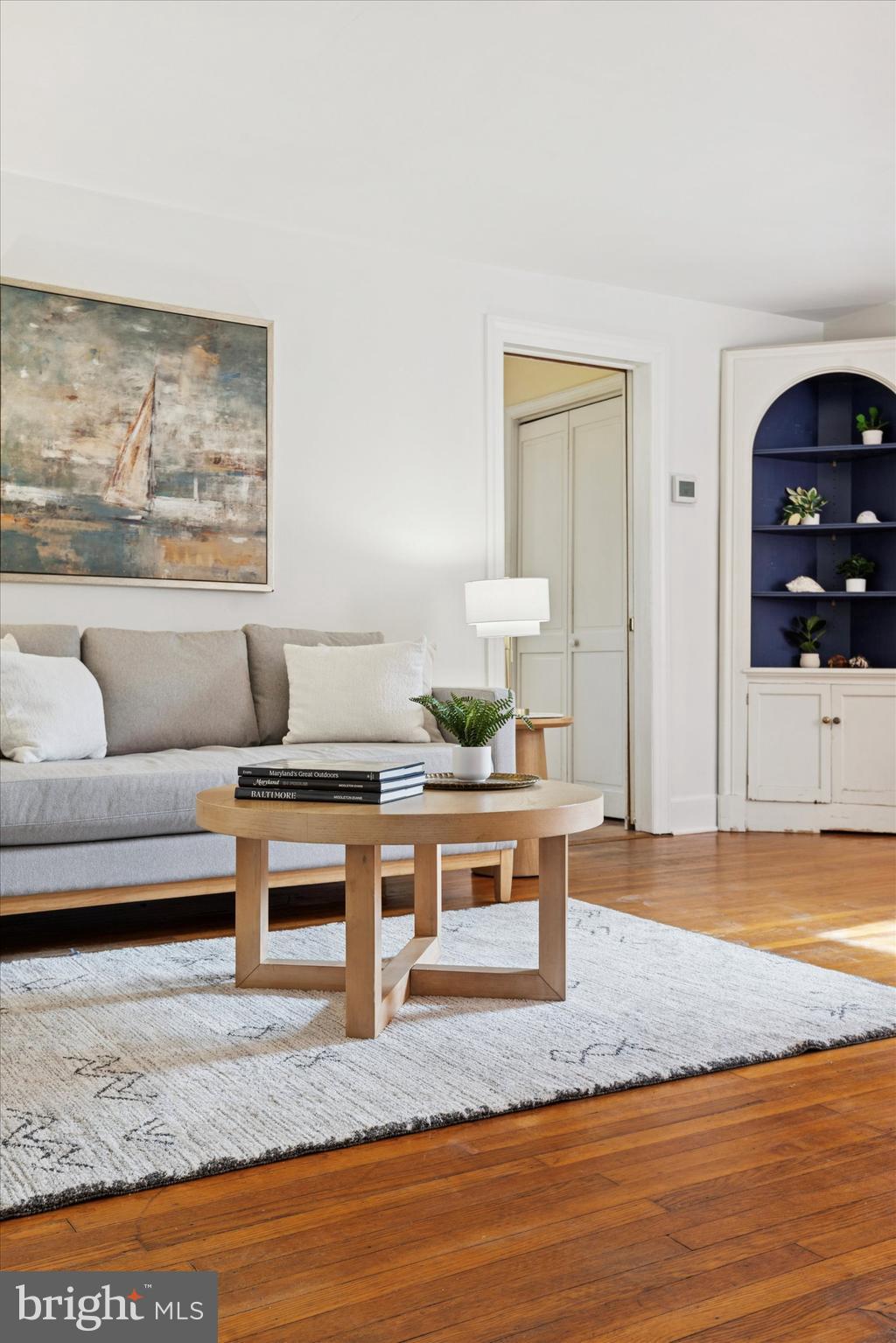 25 Green Valley Road Wallingford, PA 19086 - Photo 18 of 63 a living room with stainless steel appliances granite countertop a couch a rug and a wooden floor