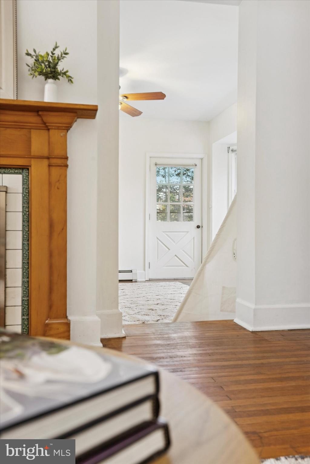 25 Green Valley Road Wallingford, PA 19086 - Photo 21 of 63 a view of entryway and hall with wooden floor