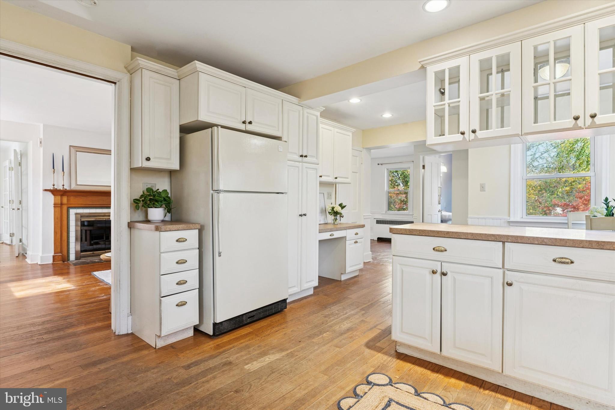 25 Green Valley Road Wallingford, PA 19086 - Photo 27 of 63 a kitchen with white cabinets and white appliances