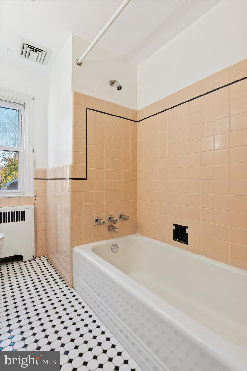 25 Green Valley Road Wallingford, PA 19086 - Photo 36 of 63 a bathroom with a bathtub and a shower