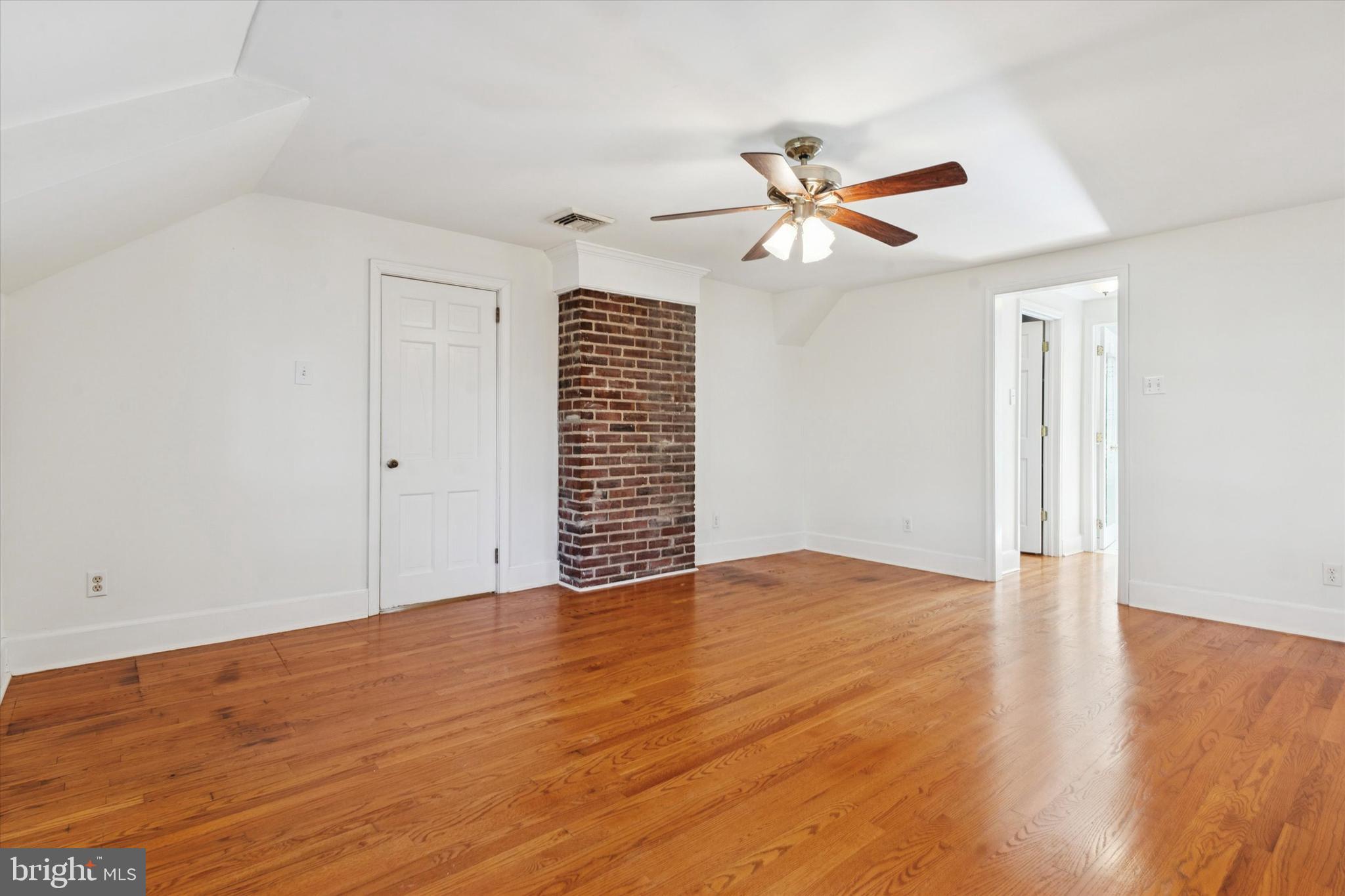 25 Green Valley Road Wallingford, PA 19086 - Photo 40 of 63 a view of empty room with wooden floor and fan