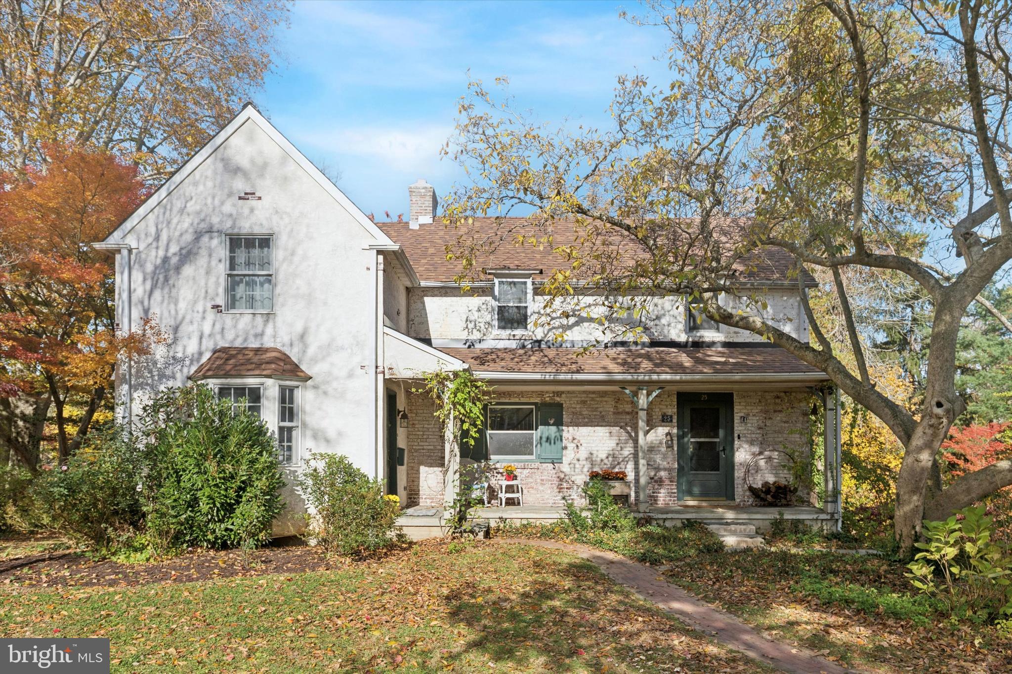 25 Green Valley Road Wallingford, PA 19086 - Photo 49 of 63 a front view of a house with garden