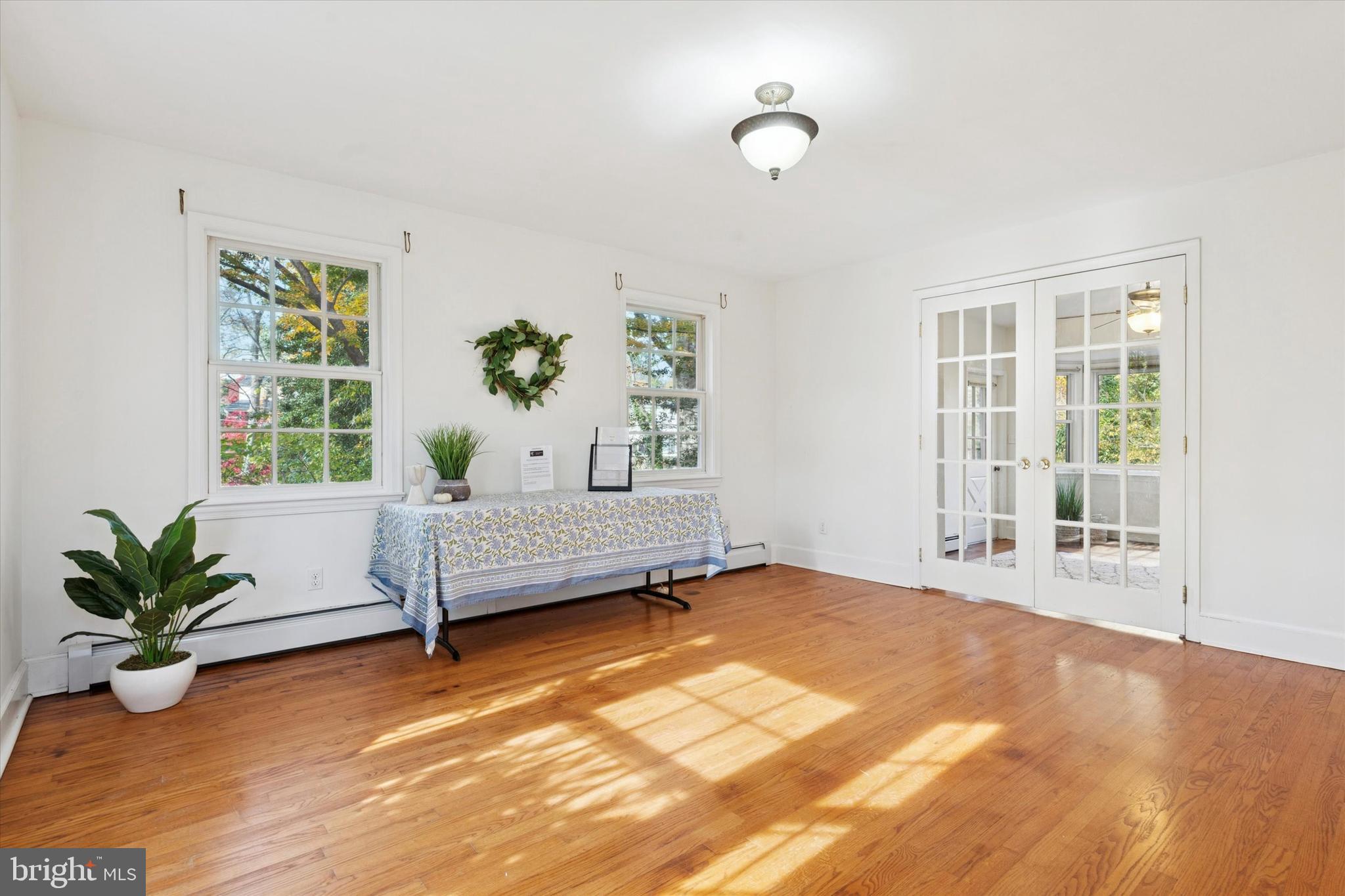 25 Green Valley Road Wallingford, PA 19086 - Photo 6 of 63 a bedroom with furniture and a potted plant