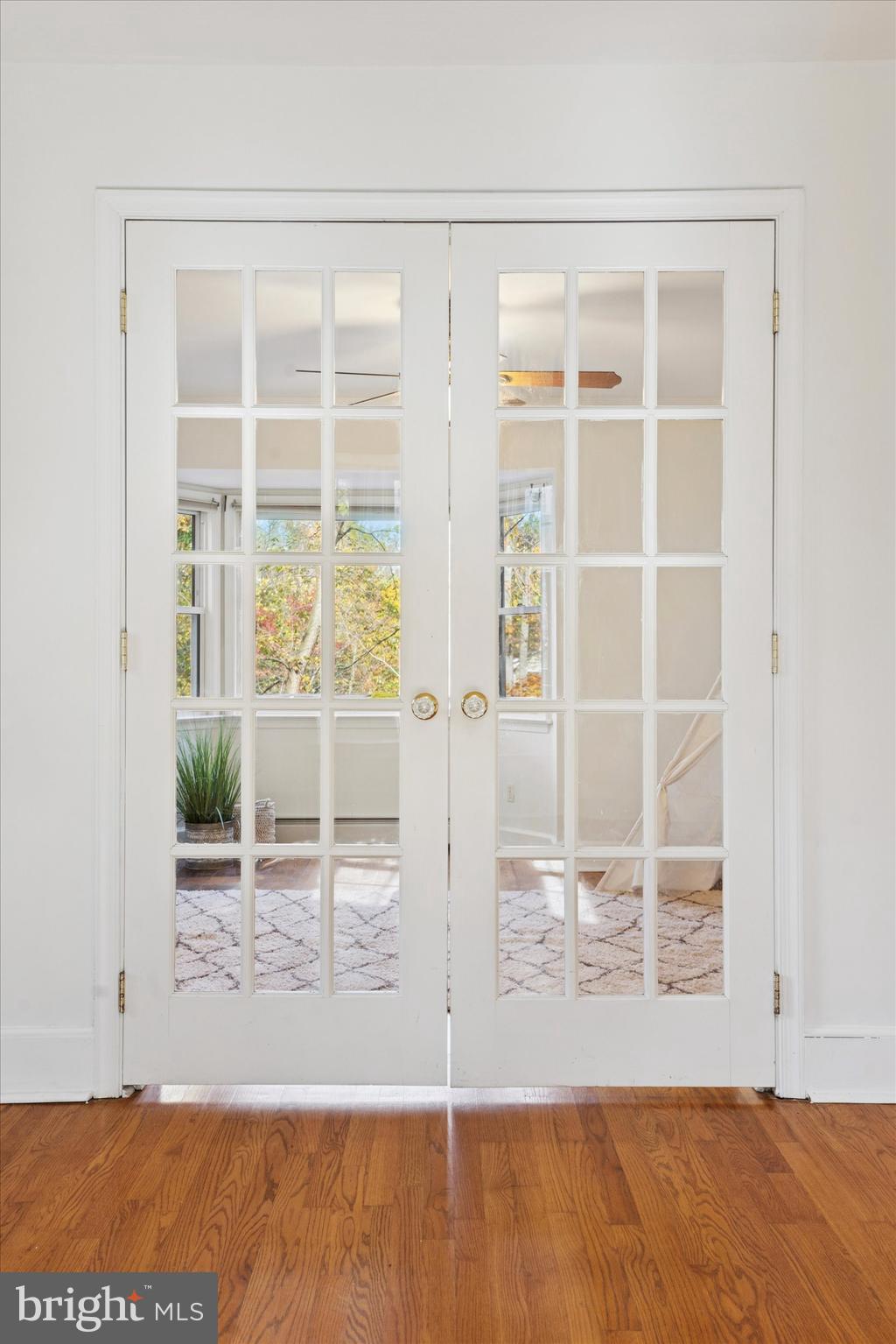 25 Green Valley Road Wallingford, PA 19086 - Photo 8 of 63 an empty room with wooden floor and windows