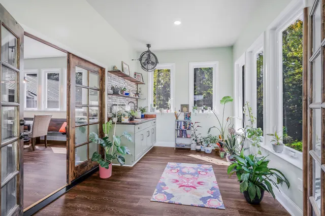 a kitchen with a sink a refrigerator and a stove