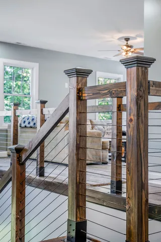 a room with furniture a rug and a window