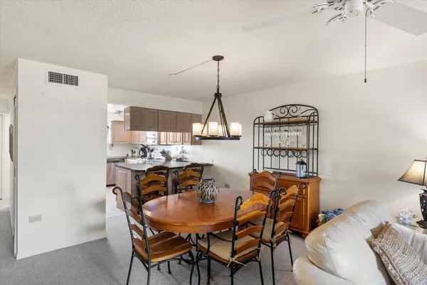 a dining room with furniture and window