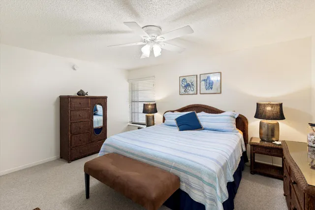 a bedroom with a bed and dresser