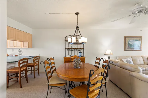 a dining room with furniture and window