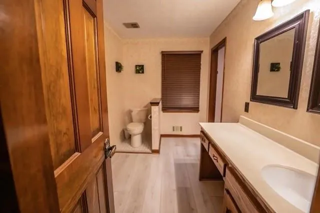 a bathroom with a sink a mirror and a bathtub