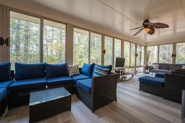 a living room with furniture and a large window