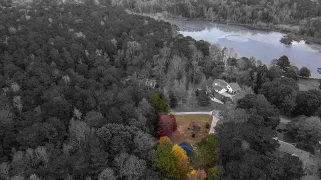 an aerial view of a house with a yard