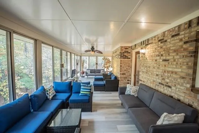 a living room with furniture and a large window