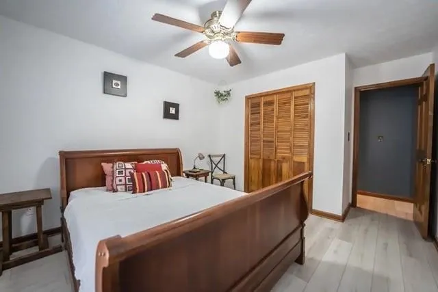 a bedroom with furniture and window