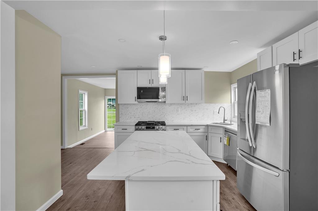 46 Terrace Road Millsboro, PA 15348 - Photo 11 of 32 a kitchen with a refrigerator sink and cabinets