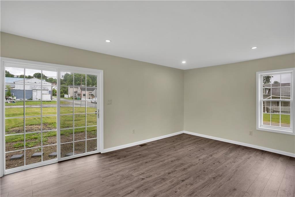 46 Terrace Road Millsboro, PA 15348 - Photo 13 of 32 a view of a big room with wooden floor and windows