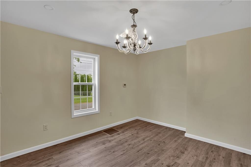 46 Terrace Road Millsboro, PA 15348 - Photo 14 of 32 a view of an empty room with wooden floor and a window