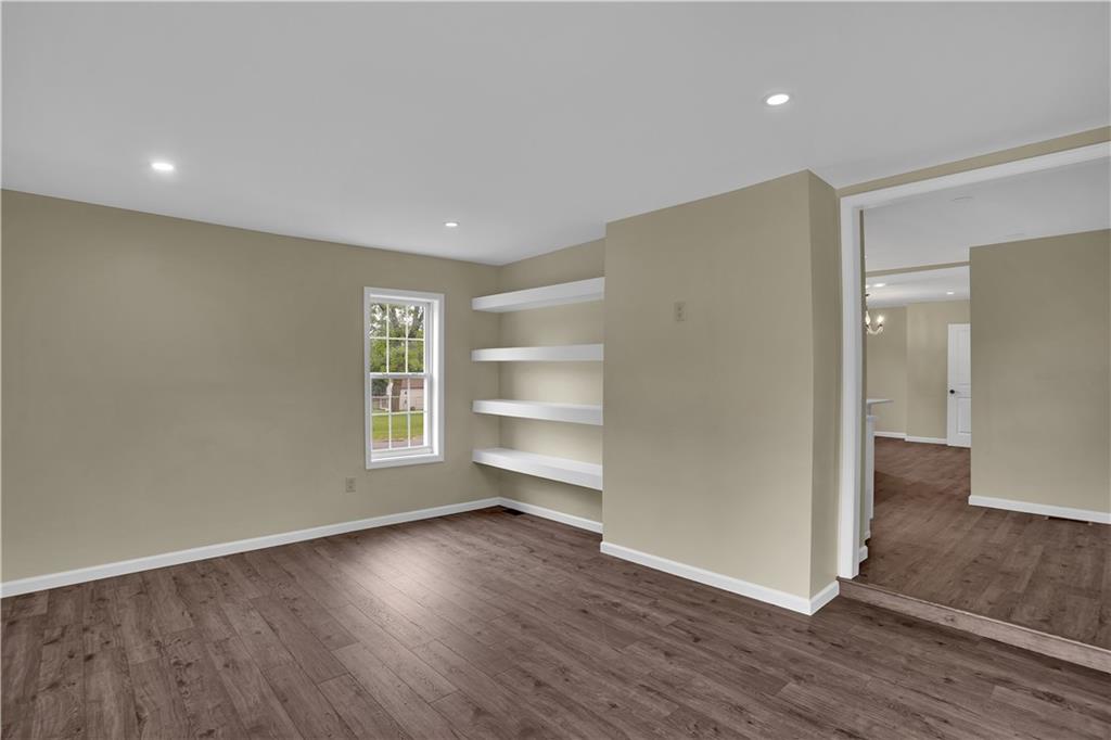 46 Terrace Road Millsboro, PA 15348 - Photo 16 of 32 a view of an empty room with a window and wooden floor