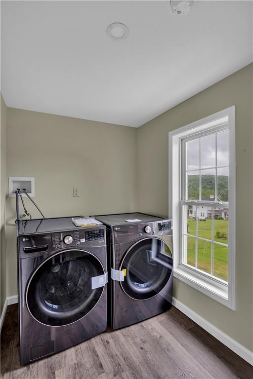 46 Terrace Road Millsboro, PA 15348 - Photo 28 of 32 a utility room with a stove and wooden floor
