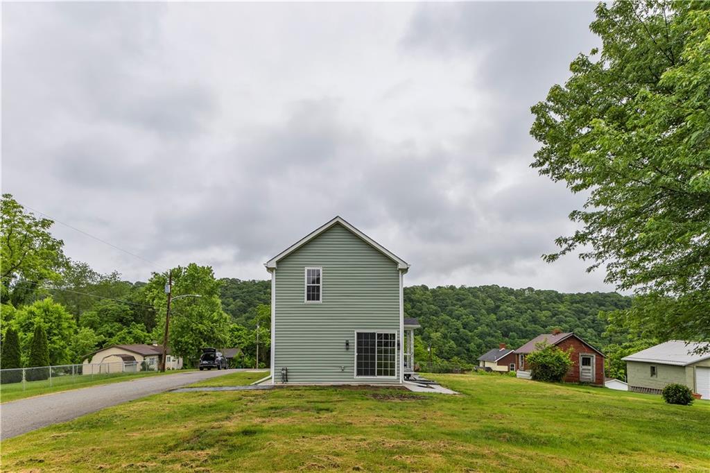 46 Terrace Road Millsboro, PA 15348 - Photo 32 of 32 a view of an house with backyard space and garden