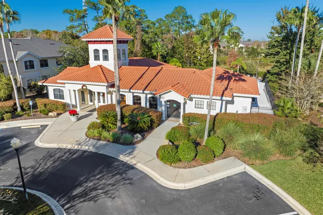 an aerial view of a house with a garden and plants