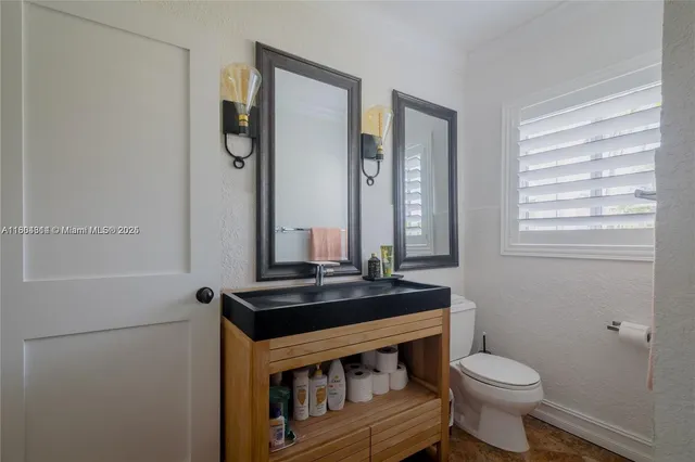 a living room with furniture rug and wooden floor