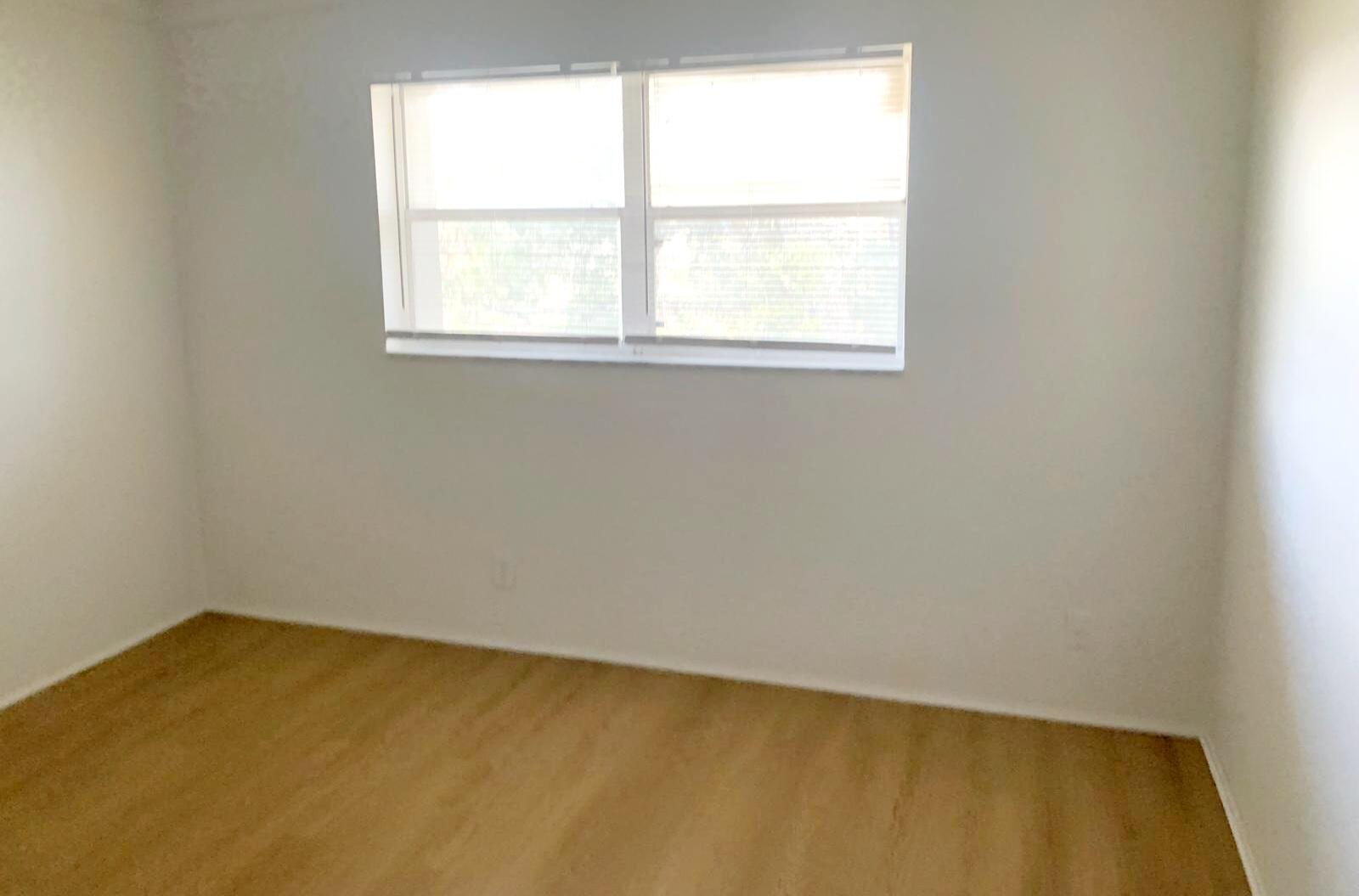 7911 North Colony Circle, Unit 305 Tamarac, FL 33321 - Photo 36 of 49 an empty room with a window