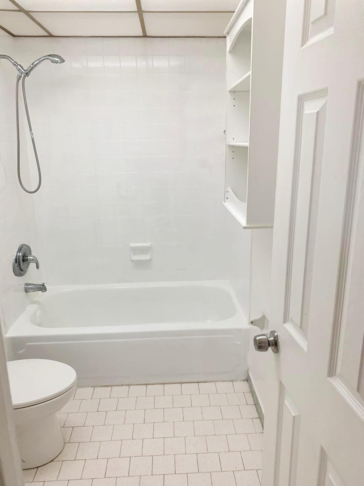 7911 North Colony Circle, Unit 305 Tamarac, FL 33321 - Photo 39 of 49 a bathroom with a shower a toilet and a bath tub