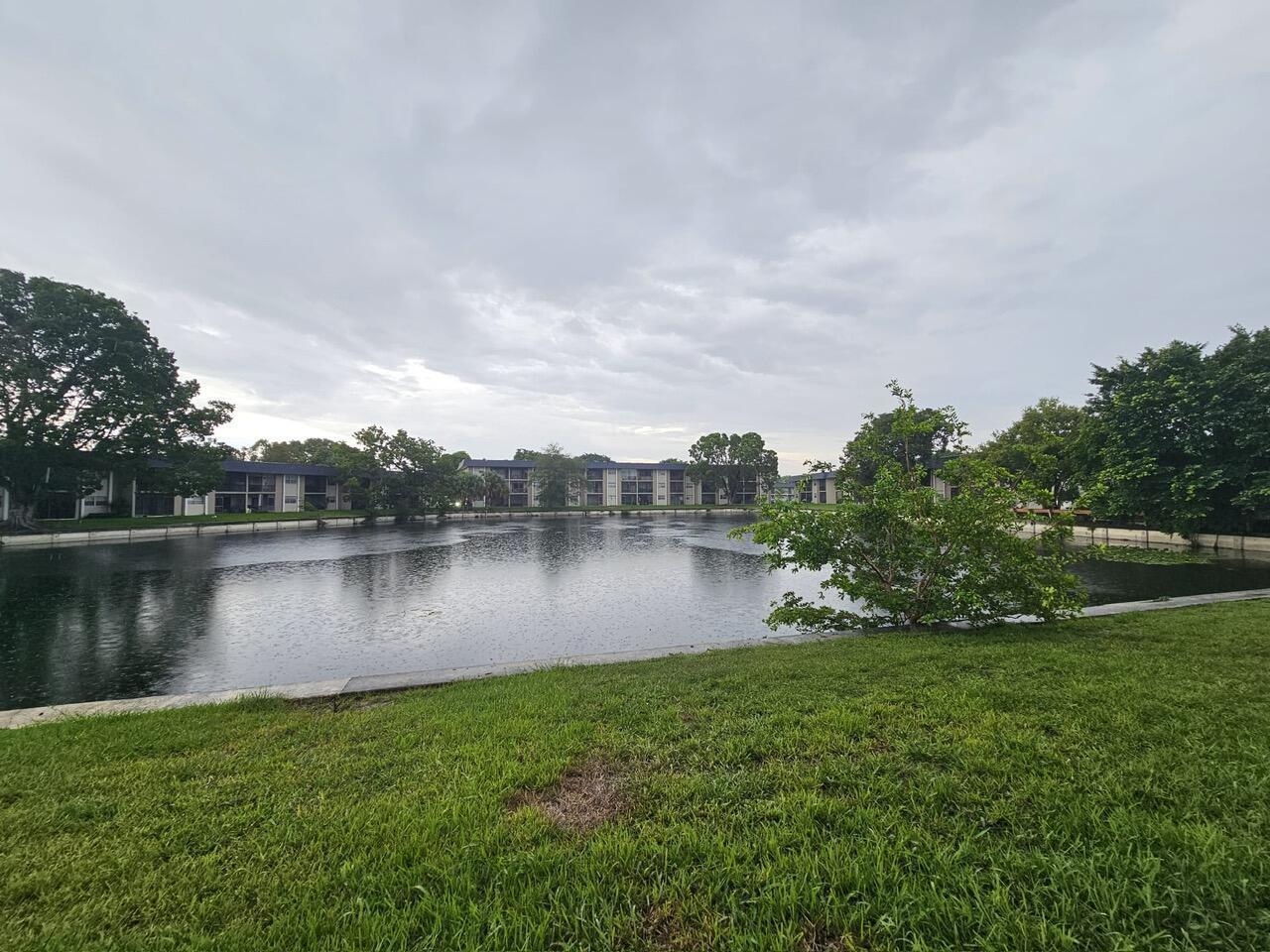7911 North Colony Circle, Unit 305 Tamarac, FL 33321 - Photo 44 of 49 a view of a lake