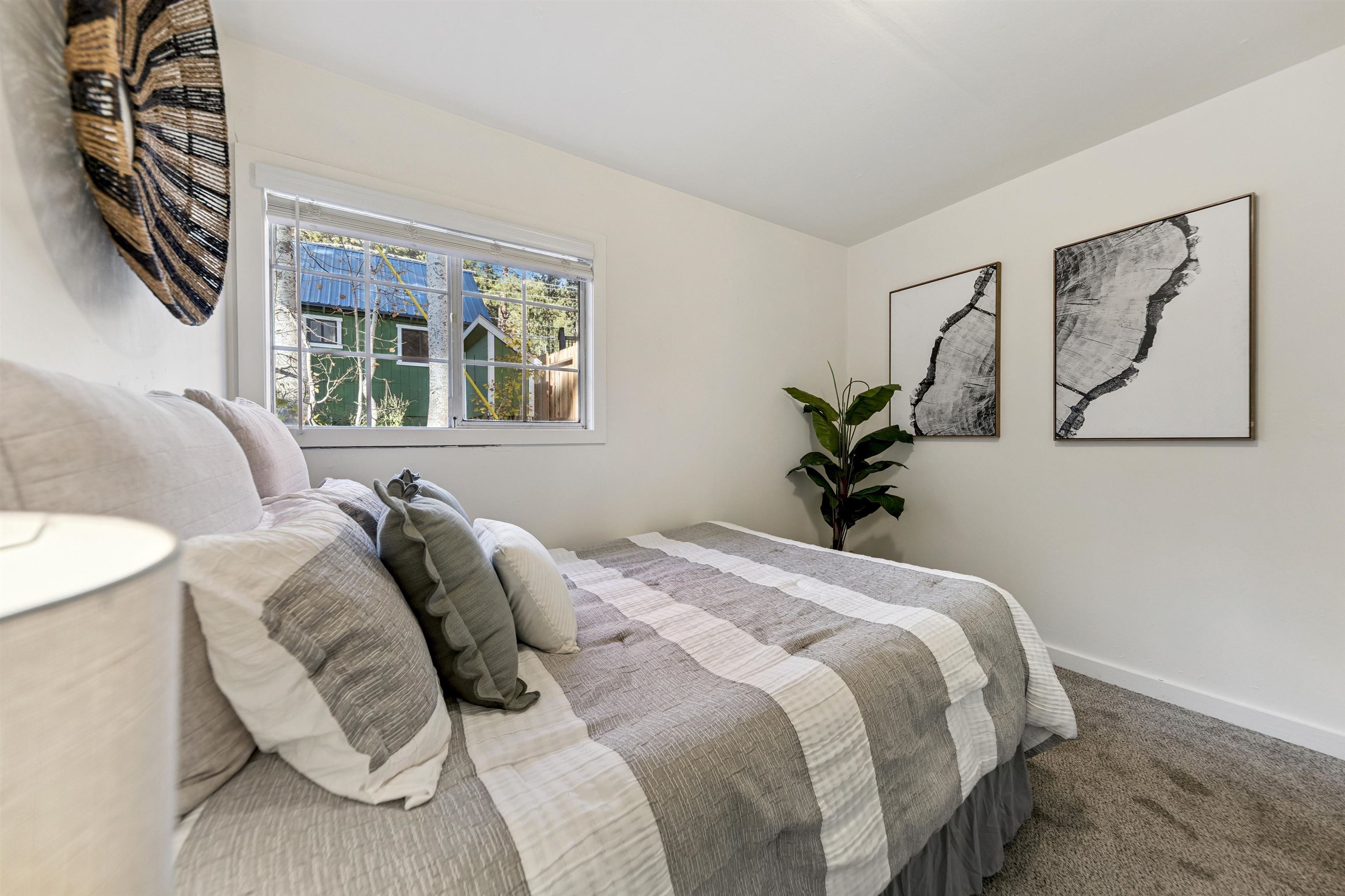 13607 Moraine Road Truckee, CA 96161 - Photo 19 of 28 a bedroom with a bed and a painting on the wall