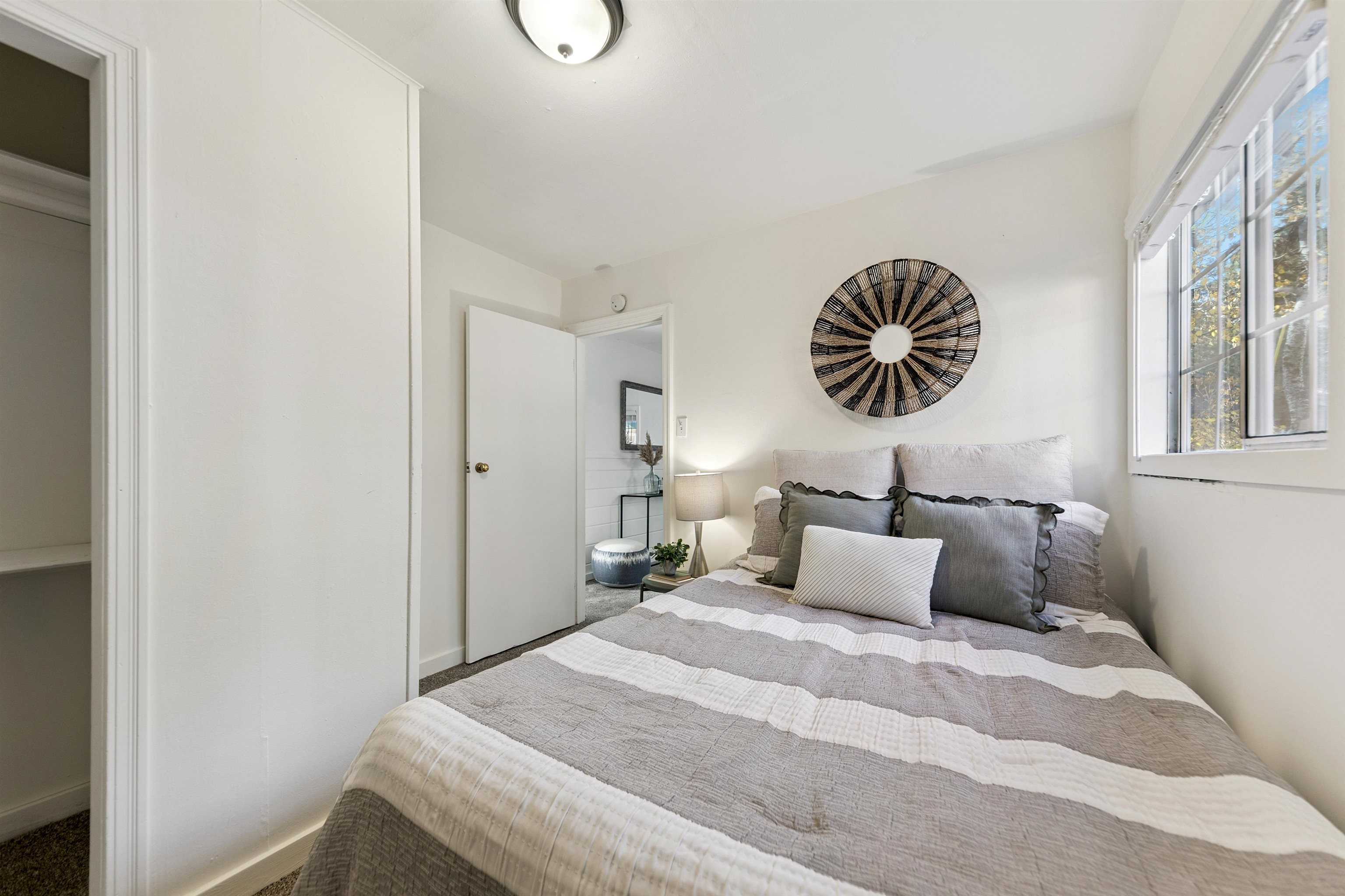 13607 Moraine Road Truckee, CA 96161 - Photo 21 of 28 a bedroom with a bed and a chandelier