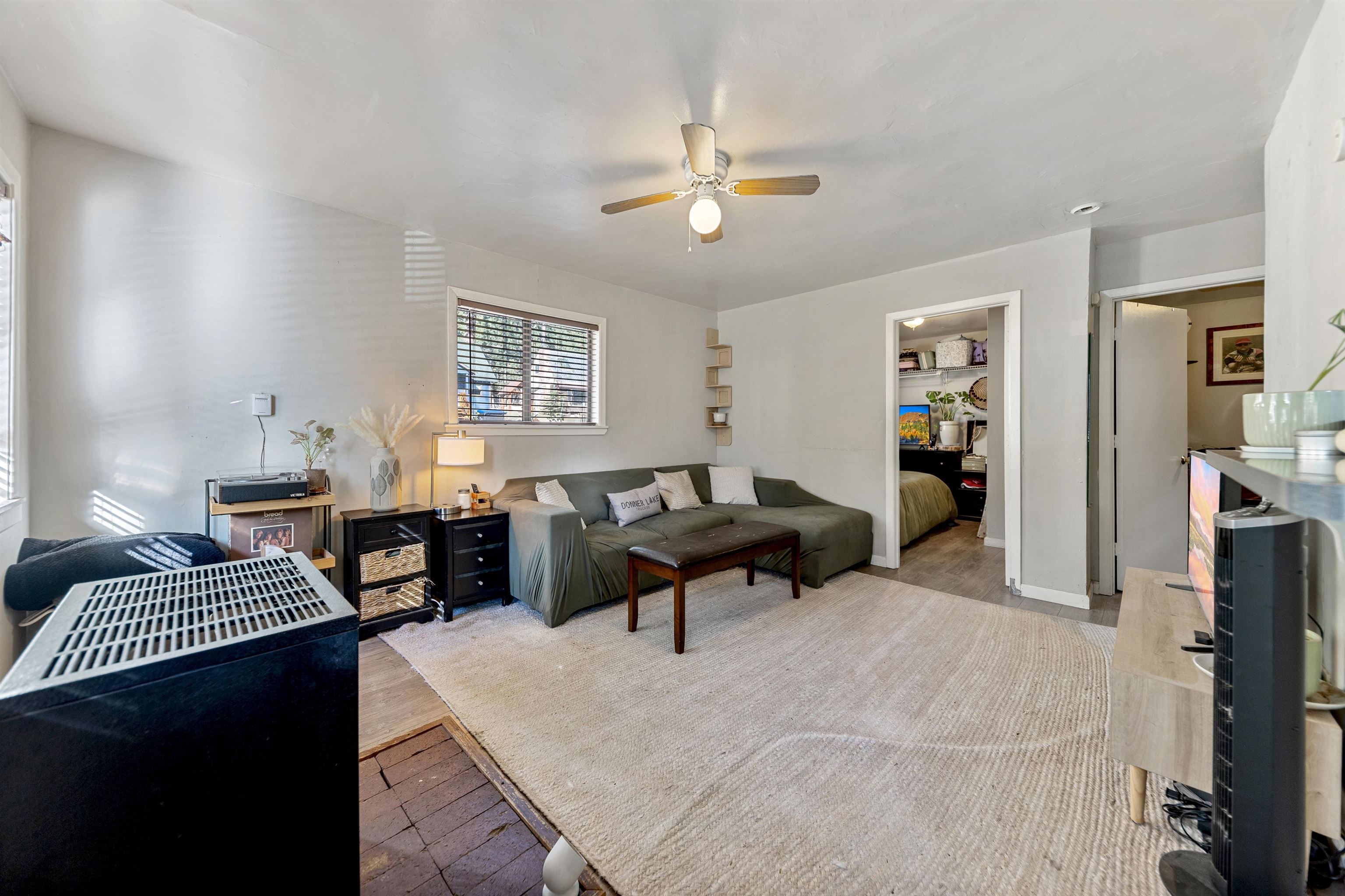 13607 Moraine Road Truckee, CA 96161 - Photo 25 of 28 a living room with furniture and a chandelier