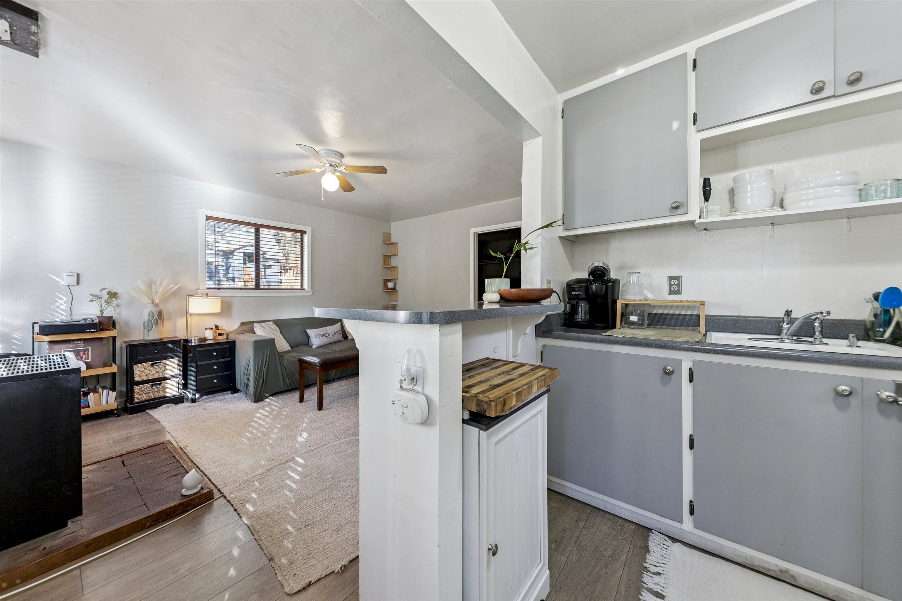 13607 Moraine Road Truckee, CA 96161 - Photo 27 of 28 a living room with furniture a dining table and kitchen view