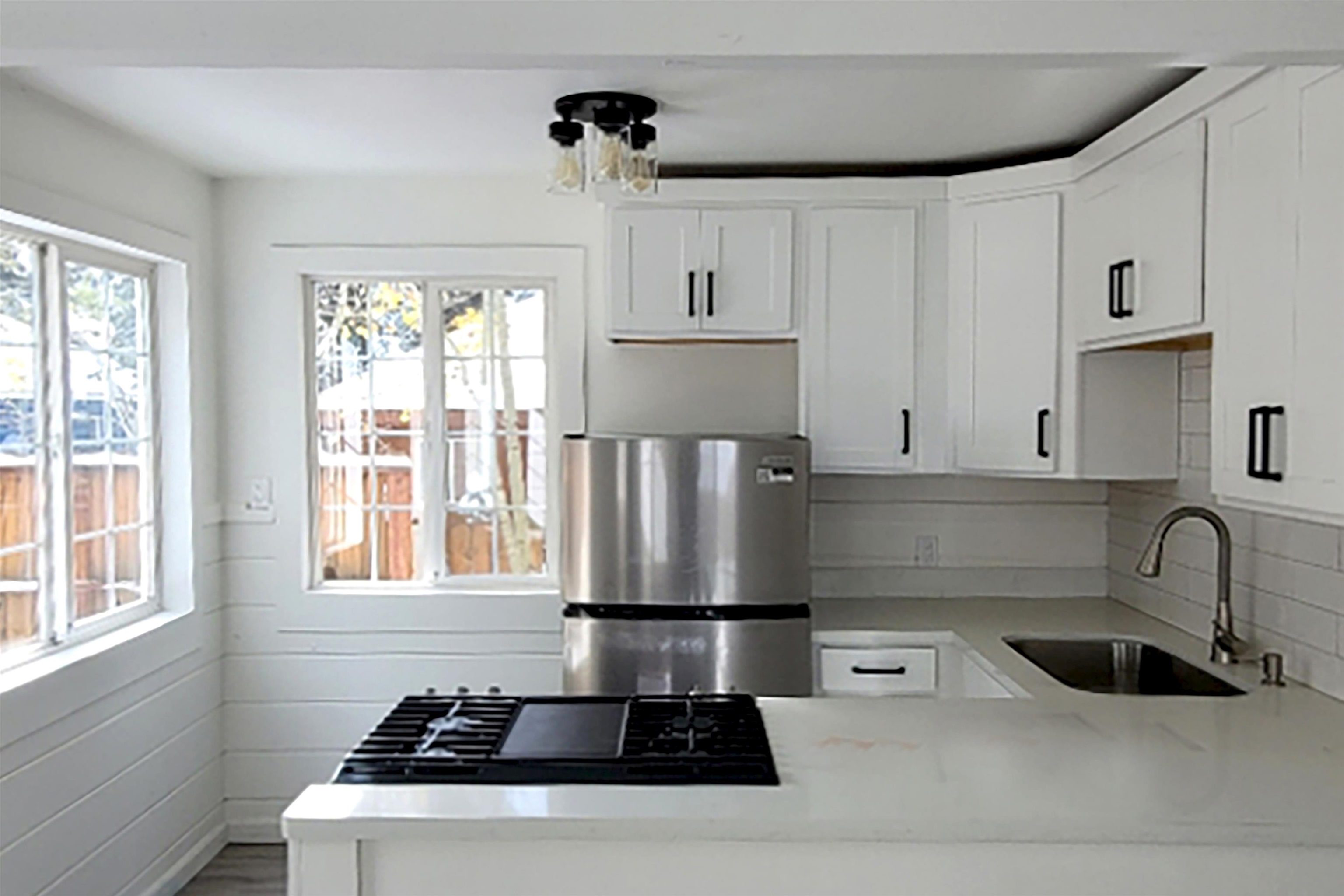 13607 Moraine Road Truckee, CA 96161 - Photo 10 of 28 a kitchen with a sink stove and cabinets