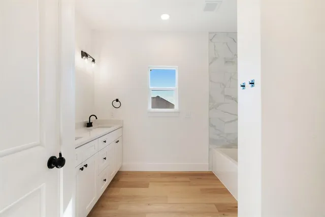 a view of an entryway with wooden floor